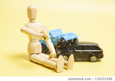 Car crash accident and wooden artist mannequin on a yellow background. Insurance concept Car crash accident and wooden artist mannequin on a yellow background. Insurance concept 110233308