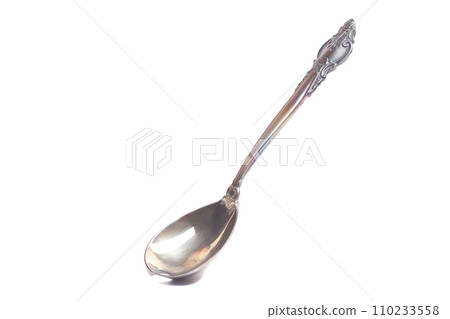 Old teaspoon isolated on white background Old teaspoon isolated on white background 110233558