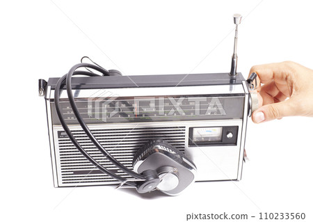 Retro ghetto radio boom box cassette recorder from 80s with hand tuning radio receiver button and headphones 110233560