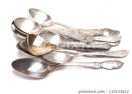 Old teaspoons isolated on white background Old teaspoons isolated on white background 110233622