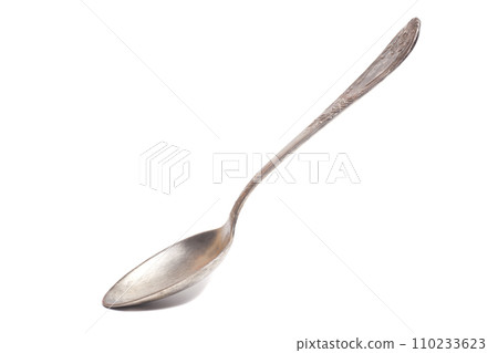 Old teaspoon isolated on white background Old teaspoon isolated on white background 110233623