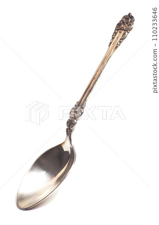Old silver teaspoon with handle pattern isolated on white background 110233646