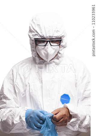 Doctor scientist in white coverall suit, mask and glasses wears blue surgical medical protective gloves. 110233961