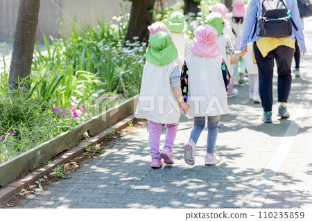 Children walking in fresh green 110235859