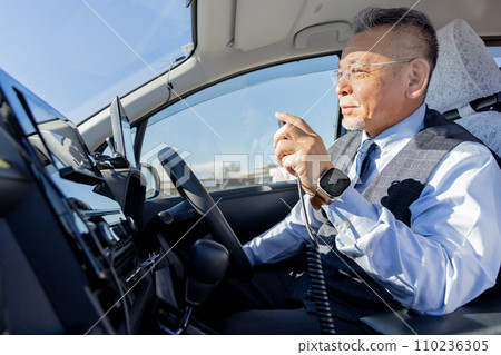 Middle-aged male taxi driver 110236305