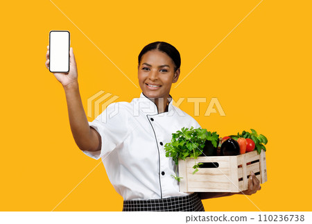 Grocery Market App. Cheerful Black Chef Woman Showing Smartphone With Empty Screen 110236738