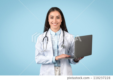 Happy female doctor with laptop, modern telemedicine concept 110237228