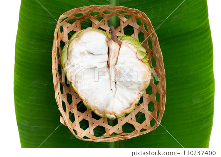 Custard apple fruit on banana leaf 110237400