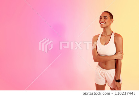 Contented young woman in sportswear stands with arms crossed, smiling confidently 110237445