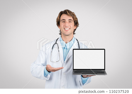 Doctor holding laptop with blank screen display 110237520