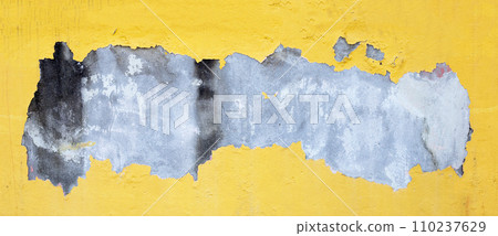Cracked yellow paint on cement wall Cracked yellow paint on cement wall 110237629
