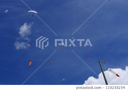 Paragliding in the blue sky 110238234