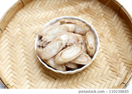 Burdock Root (Gobo) in white bown on bamboo weave plate Burdock Root (Gobo) in white bown on bamboo weave plate 110238685