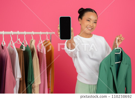 Online Sales And Mobile Application. Smiling asian lady showing blank smartphone 110238692