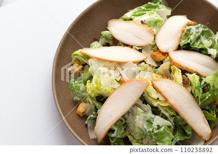Grilled chicken with caesar salad 110238892