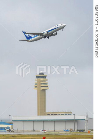 Rainy airport, plane taking off, Naha City, Okinawa Prefecture 110238908