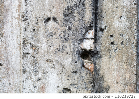 Detail of eroded building wall. Ancient damaged wall. 110239722