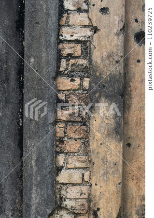 Ancient damaged brick wall surface. Ancient damaged brick wall surface. 110239725
