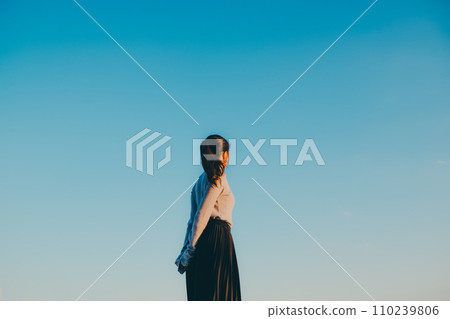 Blue sky and woman in one piece 110239806