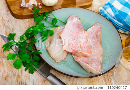 Fresh raw fillet of sea bass Fresh raw fillet of sea bass 110240427