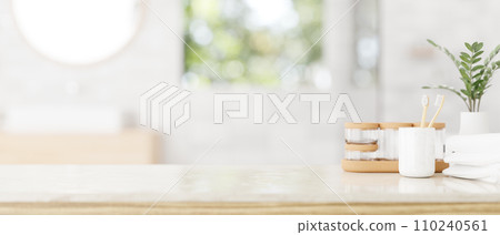 Luxury bathroom tabletop with toiletries set and copy space in a modern white bathroom. 110240561