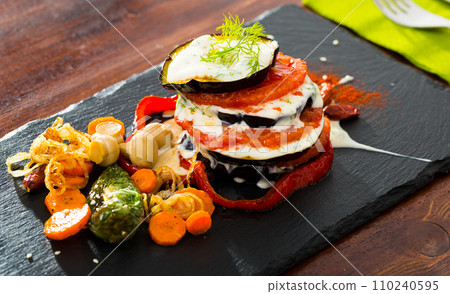 Grilled eggplants with tomatoes Grilled eggplants with tomatoes 110240595