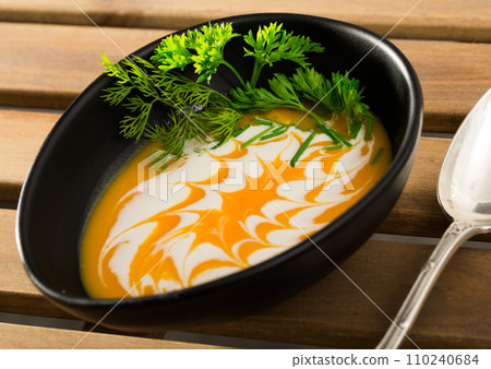 Close up of cooked homemade vegetable pumpkin and ginger cream soup 110240684