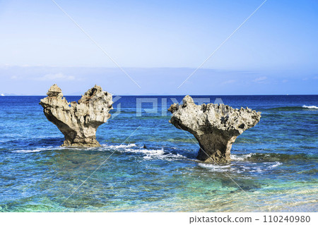 A heart rock floating in the blue sky and sea, Tinu Beach, Nakijin Village, Okinawa Prefecture 110240980