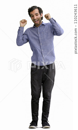 man in full growth. isolated on white background wearing headphones dancing 110243611