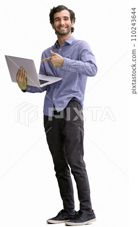young man in full growth. isolated on white background using laptop 110243644