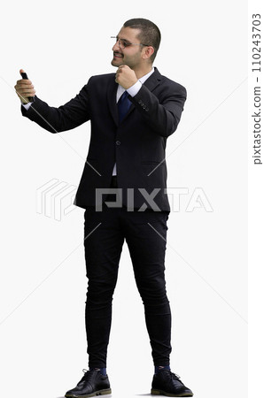 man in full growth. isolated on white background using phone man in full growth. isolated on white background using phone 110243703