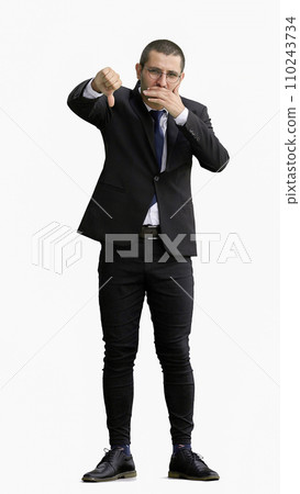 young man in full growth. isolated on white background showing bad sign with thumb 110243734