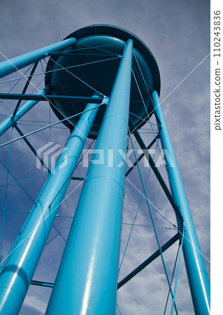 Low Angle View of Blue Water Tower Against Cloudy Sky in Allegan, Michigan 110243836