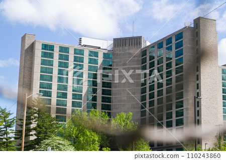 Modern Glass and Stone Building amidst Greenery in Urban Setting, Bloomington Modern Glass and Stone Building amidst Greenery in Urban Setting, Bloomington 110243860