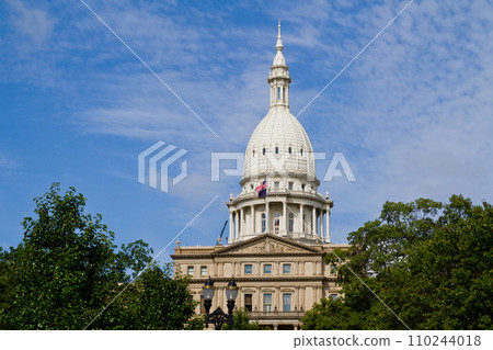 Neoclassical State Capitol Building with American Flag in Lansing, Michigan Neoclassical State Capitol Building with American Flag in Lansing, Michigan 110244018