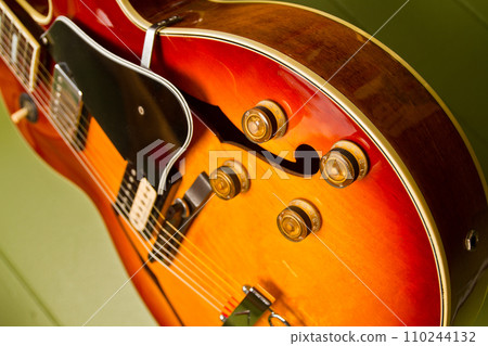Close-up Sunburst Electric Guitar in Warm Natural Light 110244132