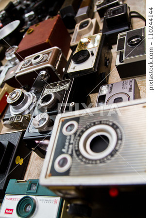 Eclectic Assortment of Vintage Cameras from Elevated Diagonal Perspective 110244144