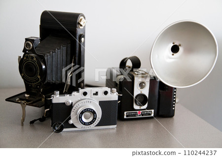 Evolution of Vintage Cameras on Neutral Background 110244237