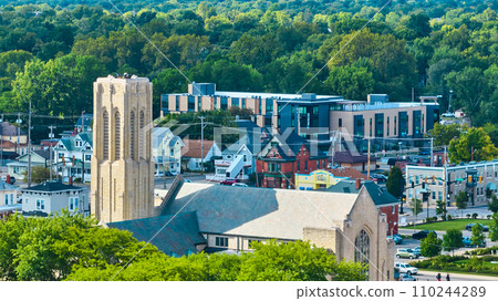 Midwest city top of church with distant new apartment complex aerial, Muncie, IN Midwest city top of church with distant new apartment complex aerial, Muncie, IN 110244289