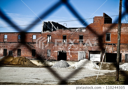 Abandoned Red Brick Factory Behind Chain-link Fence in Pierceton, Indiana Abandoned Red Brick Factory Behind Chain-link Fence in Pierceton, Indiana 110244305