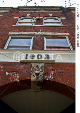 Low Angle View of Historical Red Brick Building Facade in Michigan Low Angle View of Historical Red Brick Building Facade in Michigan 110244324