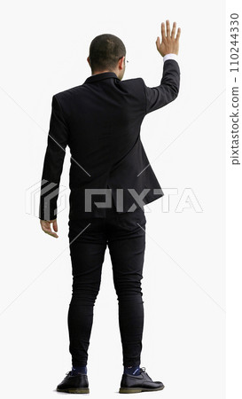 young man in full growth. isolated on white background shows hello with hand 110244330