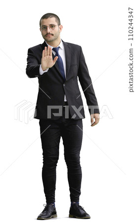 young man in full growth. isolated on white background shows stop sign with hand 110244347
