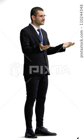 young man in full growth. isolated on white background demonstrates with hands young man in full growth. isolated on white background demonstrates with hands 110244348