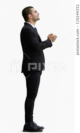 young man in full growth. isolated on white background rejoices young man in full growth. isolated on white background rejoices 110244352