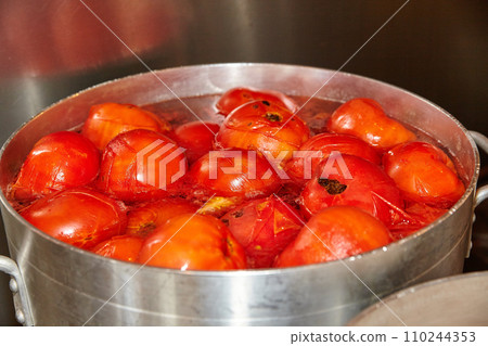 Blanching Fresh Tomatoes in Stainless Steel Pot, Kitchen Scene Blanching Fresh Tomatoes in Stainless Steel Pot, Kitchen Scene 110244353