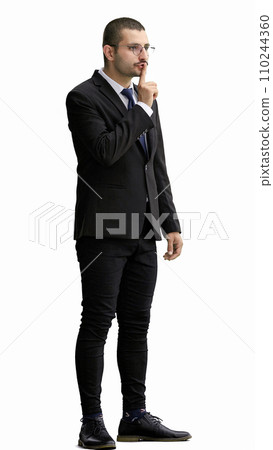 young man in full growth. isolated on white background showing with finger to keep quiet 110244360