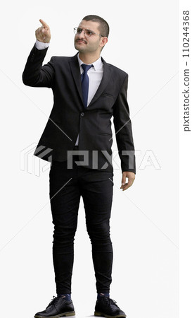 young man in full growth. isolated on white background pointing with finger 110244368