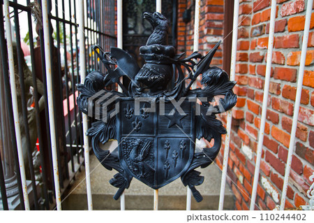Daylight View of Black Metal Crest on White Gate, Louisville 110244402