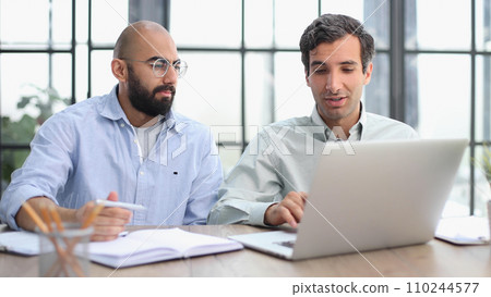Businessman working on the table with laptop in a new office 110244577